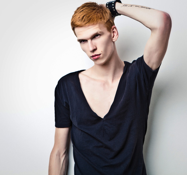 Young red haired man on light background. - Foto, Imagem