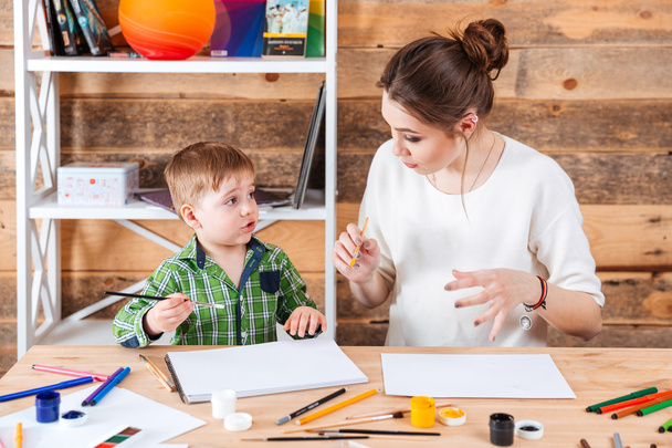 Mother and his cute little son painting together - Foto, Imagem