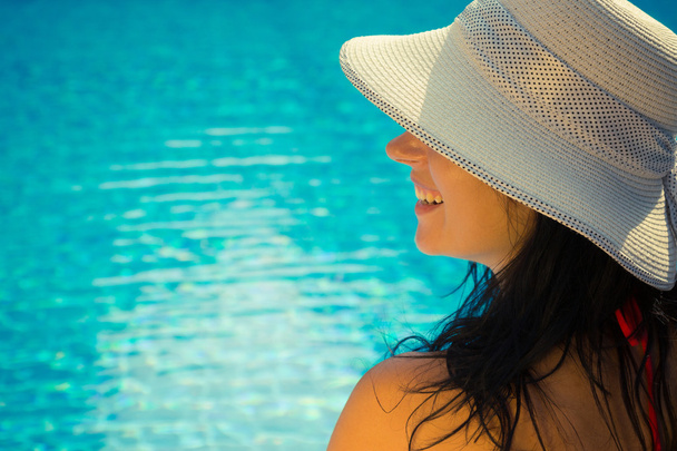 Side view portrait of a female at the poolside - 写真・画像