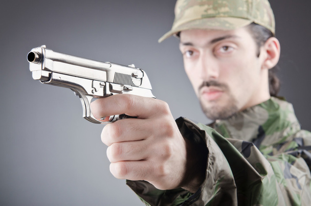 Soldier with gun in studio shooting - Photo, Image