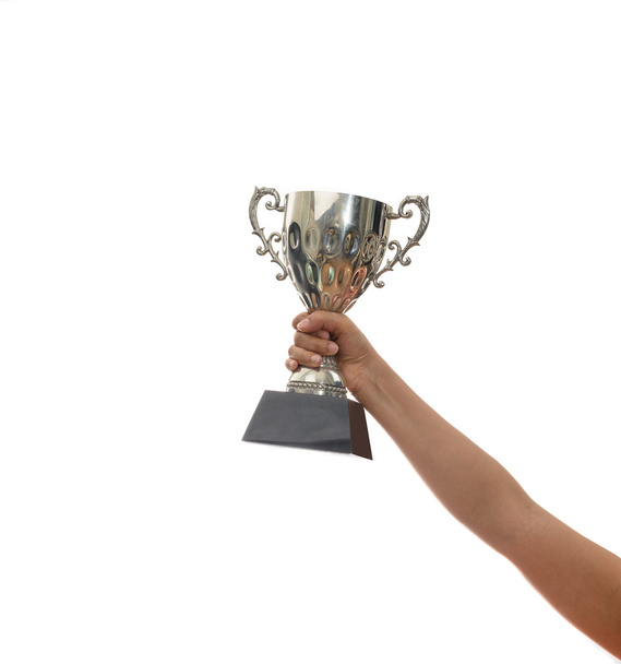 Woman holding a champion silver trophy on white background - Fotó, kép