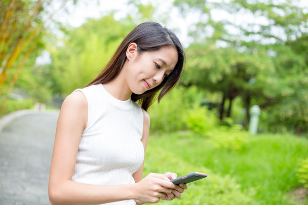 woman using smart phone at outdoor  - Valokuva, kuva