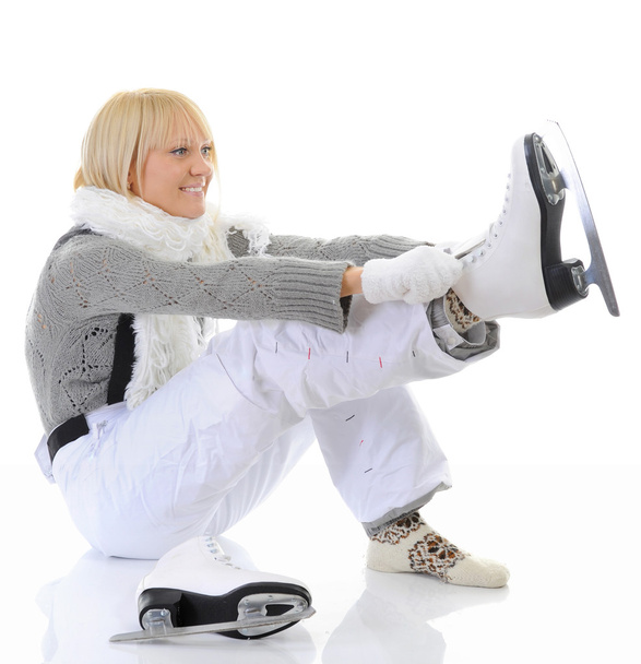 Beautiful girl puts on skates - Foto, Bild