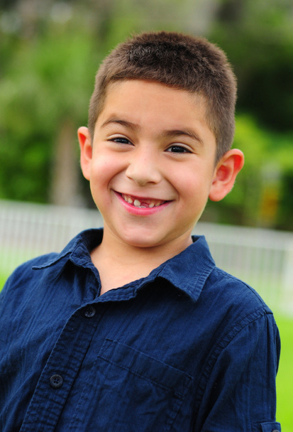 Happy latino child smiling with missing tooth - Photo, Image
