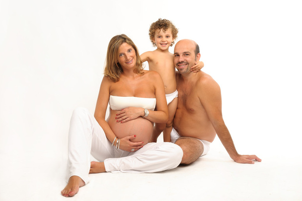 glückliche Familie mit schwangerer Frau - Foto, Bild