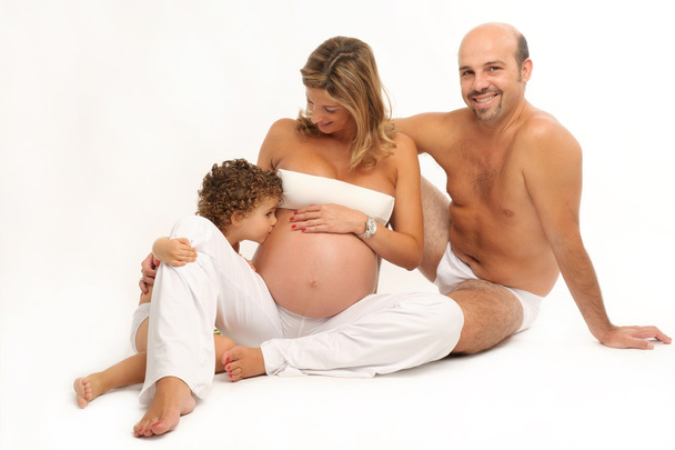 glückliche Familie mit schwangerer Frau und Kind - Foto, Bild