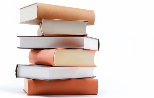 A stack of books on a white background. - Foto, Bild