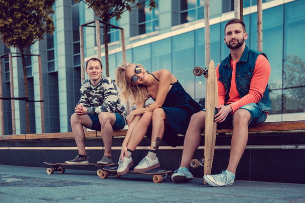 Two male and one female with longboards - Photo, Image