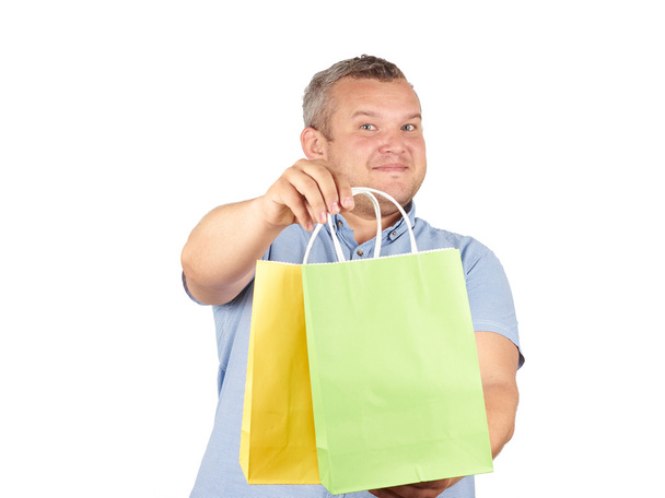 Caucasian man fat,  with colorful shopping paper bags - Foto, Imagem