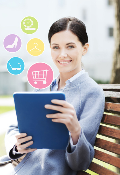 smiling business woman with tablet pc in city - Photo, image