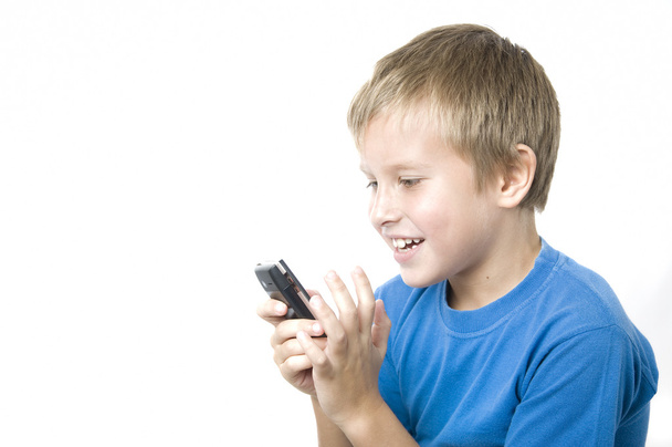 Boy Playing on Cell - Foto, afbeelding