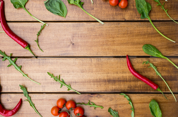 Cherry tomatoes on a wooden background - Foto, Imagen