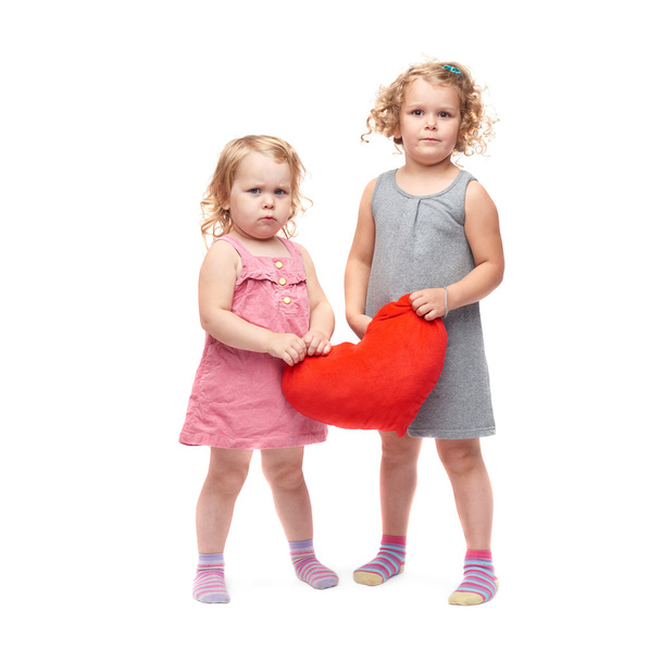 Couple of young little girls standing over isolated white background - Photo, Image