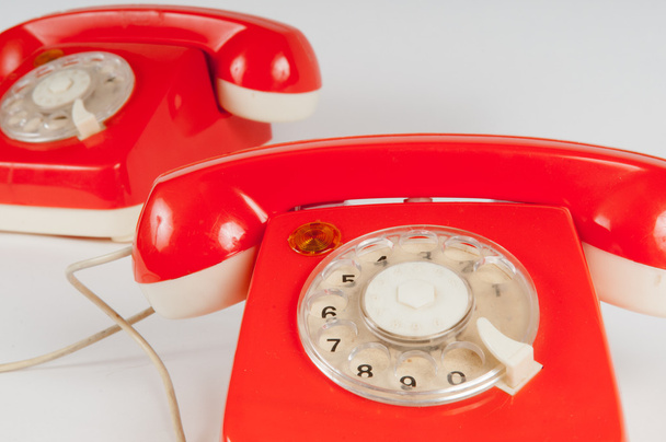 Retro oranžové telefon s rotační číselník na bílém pozadí - Fotografie, Obrázek