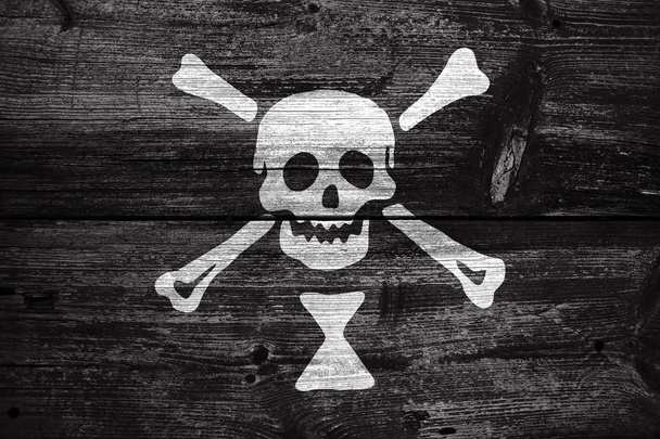 Emanuel Wynn Pirate Flag, painted on old wood plank background - Foto, Imagen