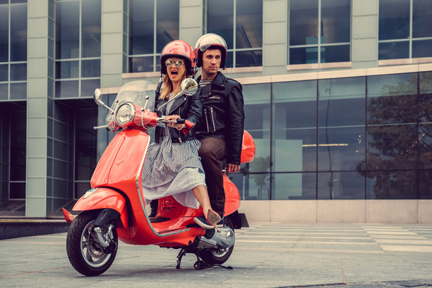 beautiful couple on retro moto scooters - Photo, Image