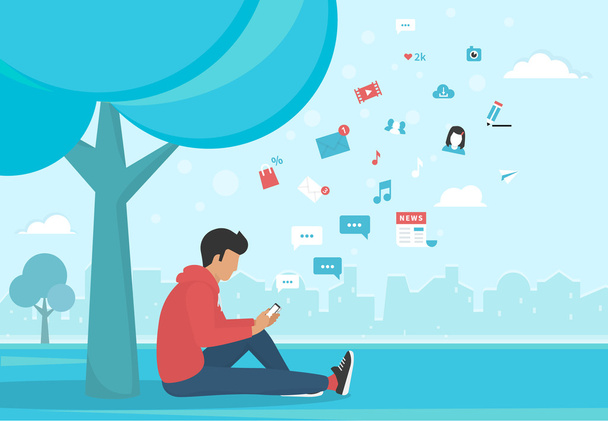 Young man sitting in the park and texting messages using smartphone - Vector, Image
