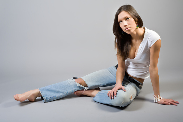 Girl in torn jeans - Φωτογραφία, εικόνα