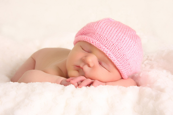 Newborn baby girl in a knitted hat - Photo, Image