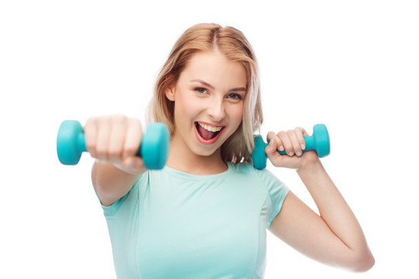 smiling beautiful young sporty woman with dumbbell - Φωτογραφία, εικόνα
