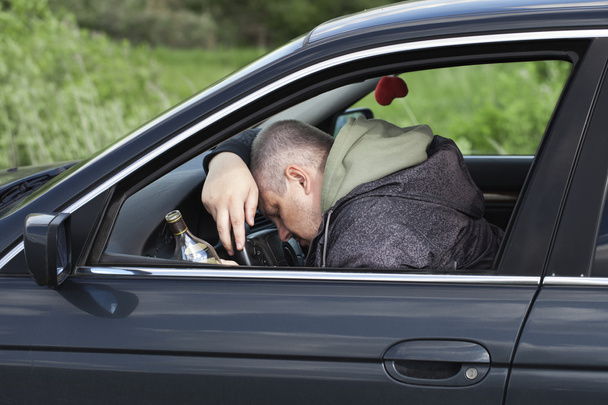 Drunk man asleep at the wheel - Фото, изображение