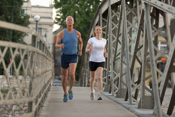 couple jogging on sunny day - Zdjęcie, obraz