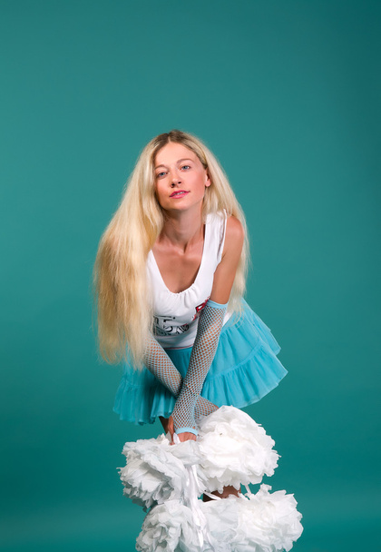 Sexy girls blonde in a white shirt and turquoise skirt - Photo, image