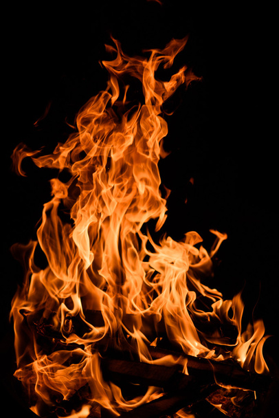 Orange fire flames isolated on black background - 写真・画像