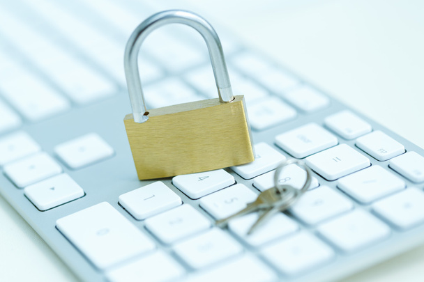 Security lock on white computer keyboard - Photo, Image