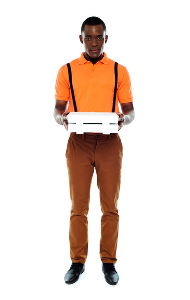 Full length portrait of delivery boy with pizza - Fotografie, Obrázek