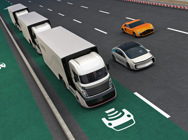 Fleet of autonomous hybrid trucks driving on wireless charging lane - Photo, Image