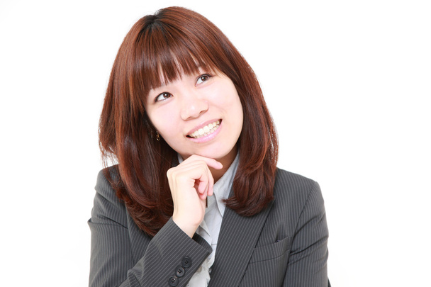 portrait of a young Japanese businesswoman thinks about something - Foto, immagini