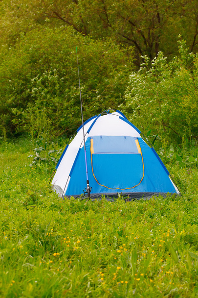 Camp tent and fishing rod on outdoor - Fotografie, Obrázek