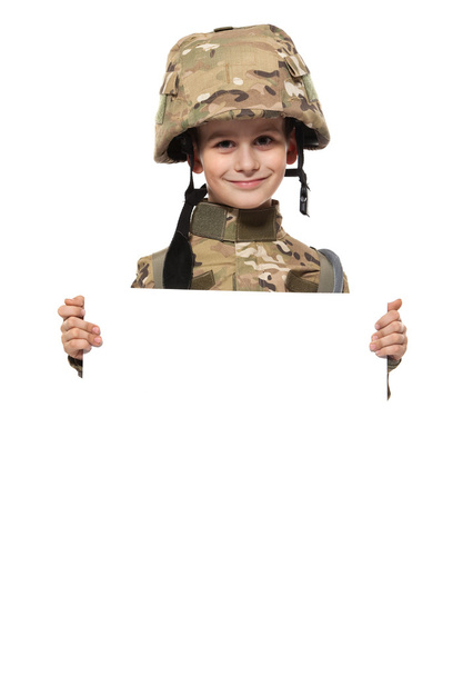 Young soldier holding a poster - Фото, изображение