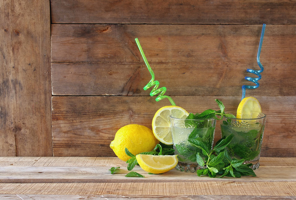 fresh mojito at the bar on a rustic wooden table - Photo, image