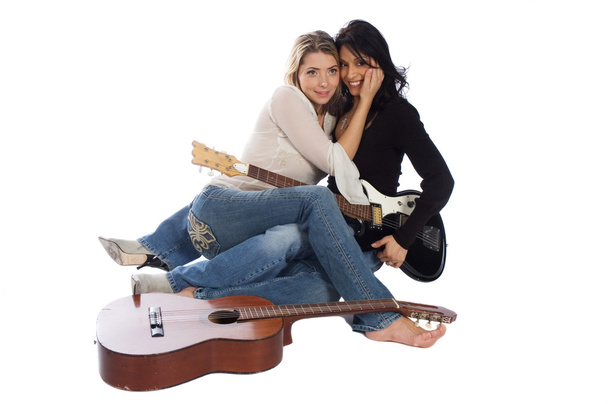 Musicians, hispanic woman sharing a moment with caucasian girl f - Photo, image