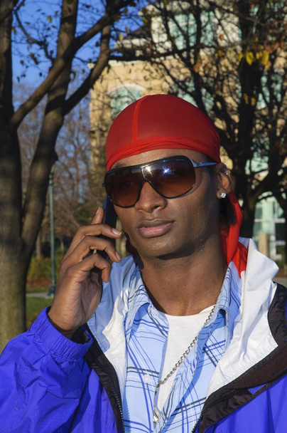 Young African American man on a cell phone - Zdjęcie, obraz