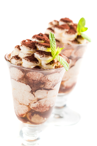 Tasty tiramisu dessert on a white background - Фото, изображение