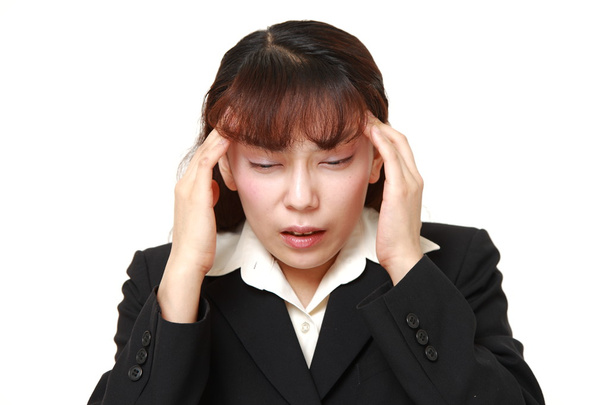 Asian businesswoman suffers from headache - Foto, immagini