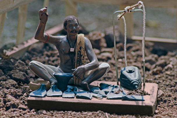 Estatua de un herrero
 - Foto, Imagen