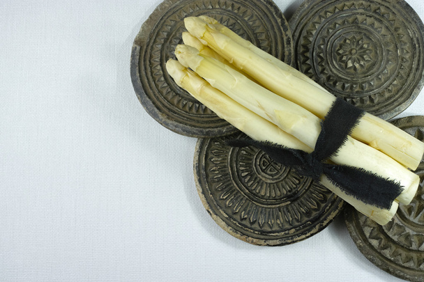 Fresh white asparagus on the grey stone boards - Photo, Image