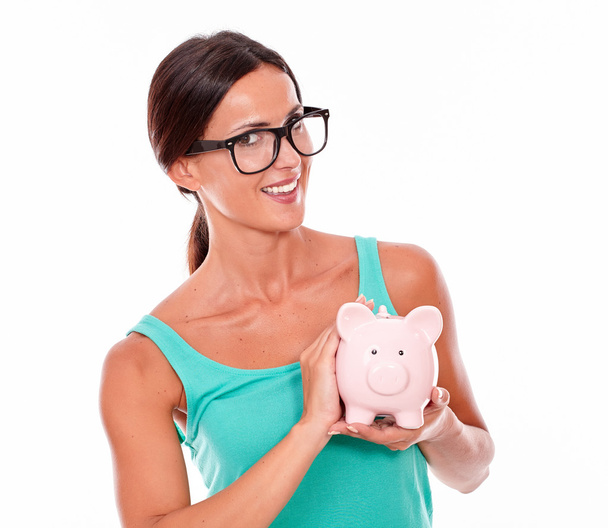 young woman with pink piggy bank - Zdjęcie, obraz