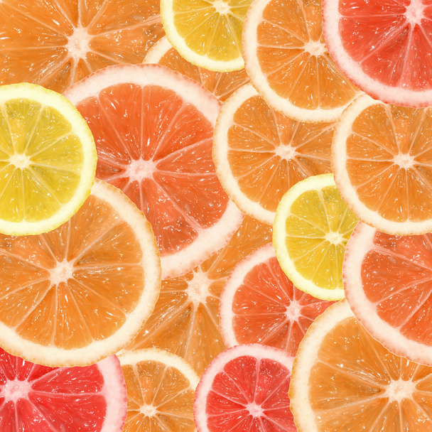 Una rodaja de limón, naranja y textura de pomelo
 - Foto, Imagen