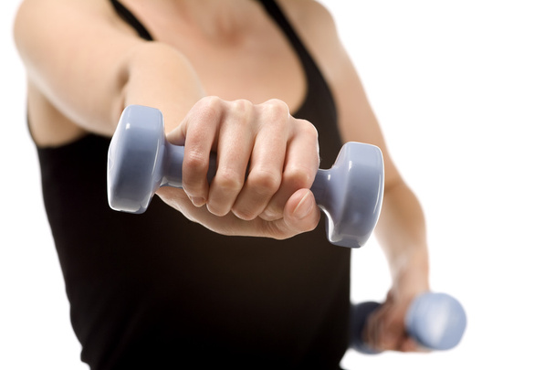 Young woman training with weights - Photo, image