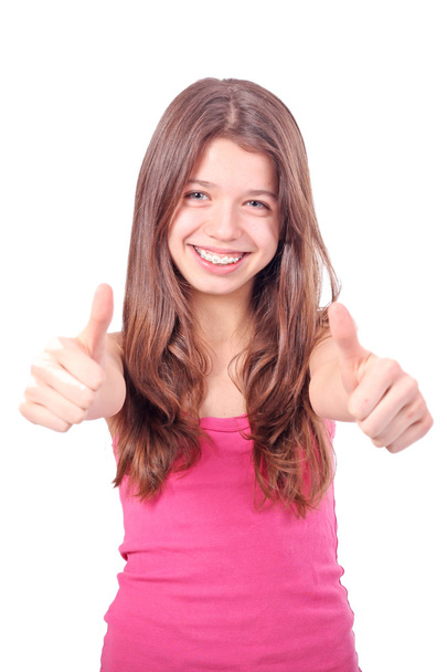 Teen beauty caucasian girl showing her thumbs up. Isolated on white. - Foto, Imagem