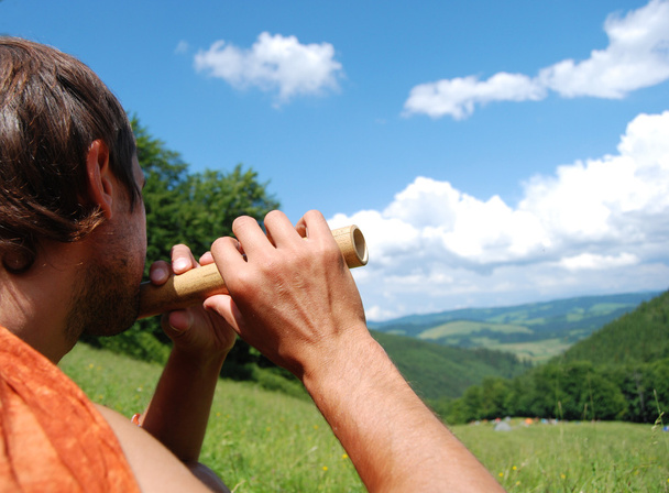 Man plays flute - Photo, Image