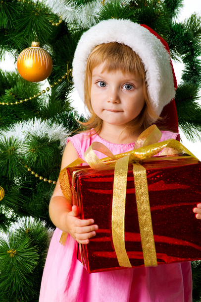 Cute girl with xmas gift - Foto, afbeelding