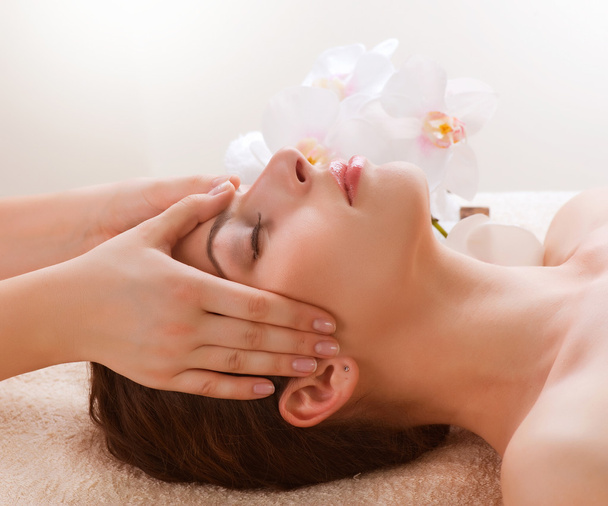 Spa Massage. Young Woman Getting Facial Massage - Foto, immagini