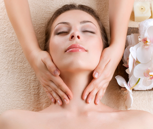 Spa Massage. Young Woman Getting Facial Massage - Фото, изображение