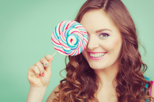  girl holding colorful lollipop candy  - Φωτογραφία, εικόνα